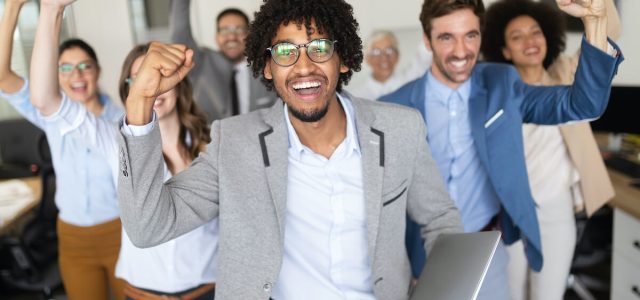 happy-business-people-celebrating-success-at-compa-2023-11-27-05-10-23-utc.jpg
